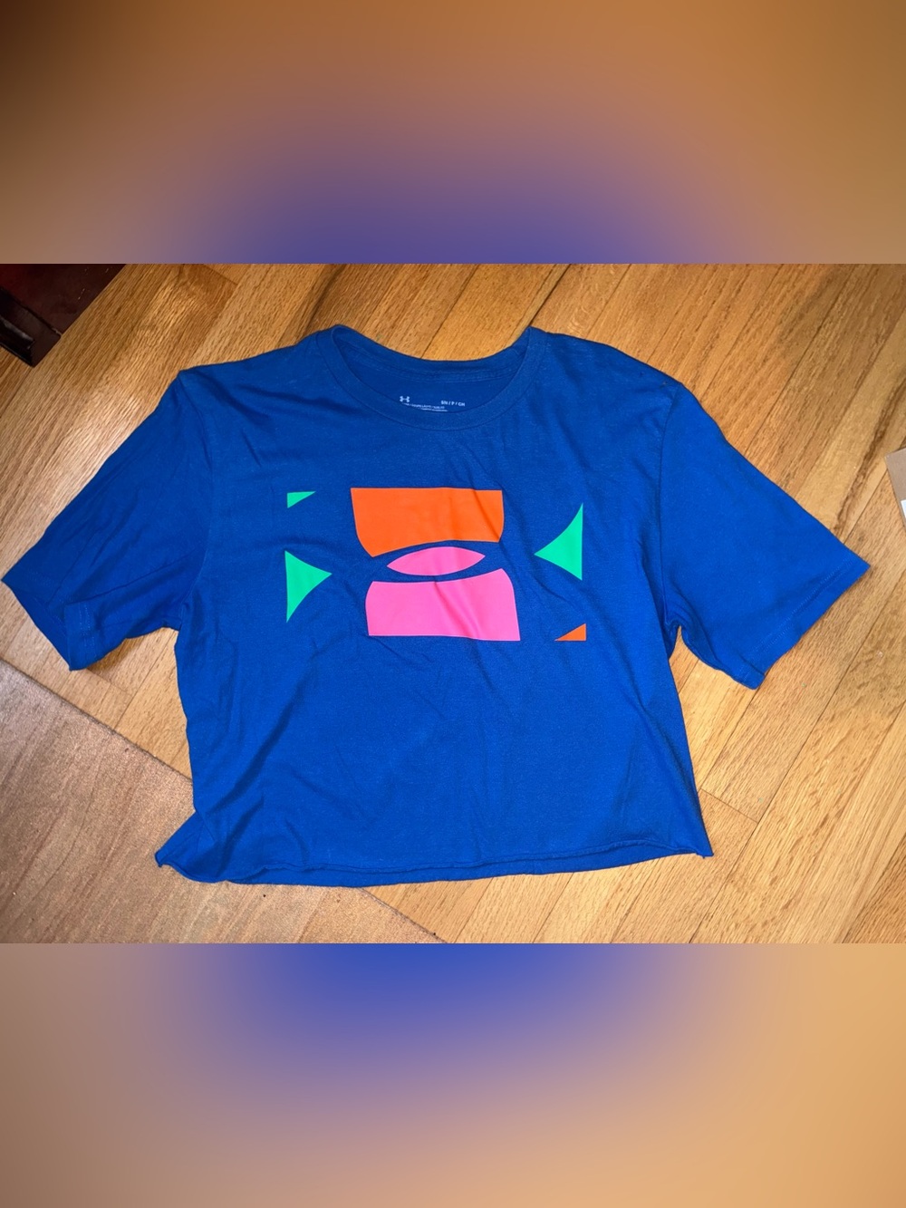 Under Armour Blue Short Sleeve cropped Tee with Pink, Orange & Green Graphic